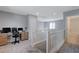 Spacious loft area with built-in workspace and bathroom access at 10122 Ashford Mill Ct, Las Vegas, NV 89178