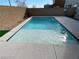 Inviting rectangular pool with light-colored coping and decking at 10122 Ashford Mill Ct, Las Vegas, NV 89178