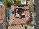 Stunning aerial view of the home with solar panels, tile roof, pool, and courtyard at 10923 Willow Heights Dr, Las Vegas, NV 89135