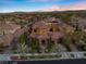 Stunning aerial view of an estate home with a tile roof, lush landscaping, and a grand entrance at 10923 Willow Heights Dr, Las Vegas, NV 89135