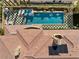 Aerial view of the property showcasing the pool, outdoor living space, and the unique architectural details of the roof at 10923 Willow Heights Dr, Las Vegas, NV 89135