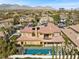 Elegant home featuring a red tiled roof, a pool, and a beautifully landscaped yard at 10923 Willow Heights Dr, Las Vegas, NV 89135