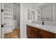 Modern bathroom with storage and sleek marble countertops at 10923 Willow Heights Dr, Las Vegas, NV 89135