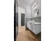 Modern bathroom with white vanity, gold accents, and patterned wallpaper at 10923 Willow Heights Dr, Las Vegas, NV 89135
