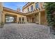 Picturesque view of the courtyard featuring ample parking and lush landscaping elements at 10923 Willow Heights Dr, Las Vegas, NV 89135