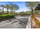 Community entry showing the gate with mature landscaping and greenery at 10923 Willow Heights Dr, Las Vegas, NV 89135
