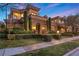 Elegant two-story home boasting a stone facade, manicured landscaping, and a welcoming entryway at 10923 Willow Heights Dr, Las Vegas, NV 89135