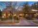 Stunning home with a porte-cochere, lush landscaping, and a beautiful facade with stone accents at 10923 Willow Heights Dr, Las Vegas, NV 89135