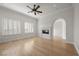 Bright living room with large windows, fireplace, plantation shutters, and neutral walls at 10923 Willow Heights Dr, Las Vegas, NV 89135