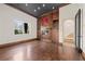 Living room with hardwood floors, built-in shelves, fireplace, and large window letting in natural light at 10923 Willow Heights Dr, Las Vegas, NV 89135