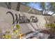 Community sign with 'Willow Falls' inscription set against a textured wall at 10923 Willow Heights Dr, Las Vegas, NV 89135