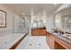 Luxurious bathroom with double vanity, soaking tub, and walk-in shower at 135 E Harmon Ave # 2721, Las Vegas, NV 89109