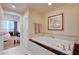 This bathroom has a soaking tub and an open doorway to the bedroom at 135 E Harmon Ave # 2721, Las Vegas, NV 89109