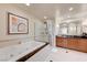 Elegant bathroom featuring a deep soaking tub and a separate glass shower at 135 E Harmon Ave # 2721, Las Vegas, NV 89109