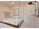 This bathroom has a glass shower and a large soaking tub at 135 E Harmon Ave # 2721, Las Vegas, NV 89109