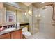 Modern bathroom featuring a glass-enclosed shower, sleek vanity, and contemporary fixtures at 135 E Harmon Ave # 2721, Las Vegas, NV 89109
