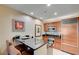 Modern kitchenette featuring granite countertops, wooden cabinetry, and stainless steel appliances at 135 E Harmon Ave # 2721, Las Vegas, NV 89109