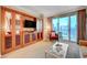 Cozy living room featuring custom millwork, comfortable seating, and city views at 135 E Harmon Ave # 2721, Las Vegas, NV 89109