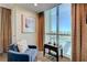 Relaxing sitting area with city views, plush chairs, and stylish decor at 135 E Harmon Ave # 2721, Las Vegas, NV 89109