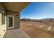 View of backyard with gravel and surrounding desert landscape at 251 Glenoaks St, Pahrump, NV 89048