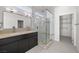 Modern bathroom with double vanity, glass shower, and walk-in closet at 251 Glenoaks St, Pahrump, NV 89048