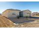 Side view of the house showcasing its beige exterior and landscaping at 251 Glenoaks St, Pahrump, NV 89048