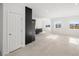 Open concept living area with tile floors and views to kitchen at 251 Glenoaks St, Pahrump, NV 89048