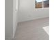 Bright living room with light gray vinyl flooring and an open floor plan at 251 Glenoaks St, Pahrump, NV 89048