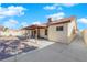 Spacious backyard featuring a covered patio, brick pavers, and a low-maintenance desert landscape at 2829 Forrest Duke Ct, Las Vegas, NV 89108