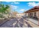 The backyard is a fully landscaped retreat with a covered patio and basketball court at 2829 Forrest Duke Ct, Las Vegas, NV 89108