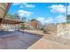 Large backyard featuring a covered patio, brick pavers, mature landscaping, and a fire pit at 2829 Forrest Duke Ct, Las Vegas, NV 89108