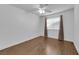 This bedroom has laminated wood floors, a ceiling fan and a large window at 2829 Forrest Duke Ct, Las Vegas, NV 89108
