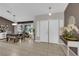 Inviting entryway with neutral tones, white trim, tile flooring, and dining area adjacent to the large window at 2829 Forrest Duke Ct, Las Vegas, NV 89108