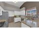 Bright kitchen featuring white cabinets and granite countertops at 2829 Forrest Duke Ct, Las Vegas, NV 89108