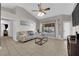 Comfortable living room with large windows offering a view of the backyard at 2829 Forrest Duke Ct, Las Vegas, NV 89108