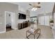 Spacious living area featuring a large TV,tile floors and ample natural light at 2829 Forrest Duke Ct, Las Vegas, NV 89108