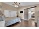 Inviting main bedroom featuring a barn-style sliding door and wood-look floors at 2829 Forrest Duke Ct, Las Vegas, NV 89108