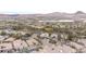Aerial view of a residential neighborhood with a lake and mountain views in the background at 36 Avenida Fiori, Henderson, NV 89011