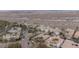 Aerial view of a residential neighborhood with desert landscape, tile roofs and palm trees at 36 Avenida Fiori, Henderson, NV 89011