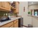 Convenient wet bar featuring granite countertops, wine storage, and mini fridge, ideal for entertaining guests at 36 Avenida Fiori, Henderson, NV 89011