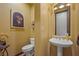 Charming powder room with pedestal sink, decorative mirror, and stylish accents at 36 Avenida Fiori, Henderson, NV 89011