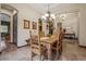 Inviting dining area featuring a wood table and chairs with entryways to the kitchen and living room at 36 Avenida Fiori, Henderson, NV 89011