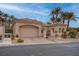 Charming single-story home featuring a tile roof, attached garage, gated courtyard, and drought-tolerant landscaping at 36 Avenida Fiori, Henderson, NV 89011