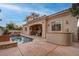 Beautiful backyard featuring a pool, outdoor kitchen and dining area at 36 Avenida Fiori, Henderson, NV 89011