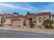 Charming single-story home featuring a desert landscape, tile roof, and inviting curb appeal at 36 Avenida Fiori, Henderson, NV 89011