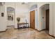 Elegant foyer featuring travertine floors, high ceilings, arched doorways, and a decorative console table at 36 Avenida Fiori, Henderson, NV 89011