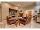 Inviting living room with cozy seating, fireplace, and stone accent wall, perfect for relaxation at 36 Avenida Fiori, Henderson, NV 89011