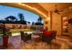 Inviting outdoor living space with a cozy fire pit, plush seating and tranquil pool view at 36 Avenida Fiori, Henderson, NV 89011