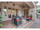 Inviting outdoor patio with comfortable seating and a stone fire pit at 36 Avenida Fiori, Henderson, NV 89011