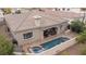 Beautiful home features a pool, spa, covered patio, and outdoor kitchen, perfect for outdoor entertaining at 36 Avenida Fiori, Henderson, NV 89011